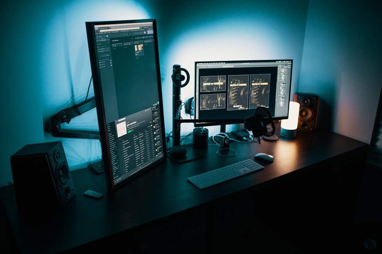 service-03 A contemporary office desk featuring a dual monitor setup with stylish lighting, ideal for tech enthusiasts.