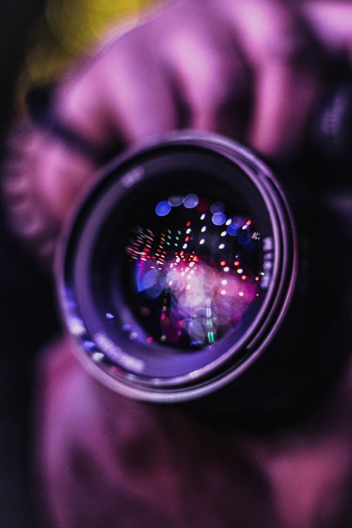 service-02 Vibrant reflections in a camera lens; an artistic photography close-up.