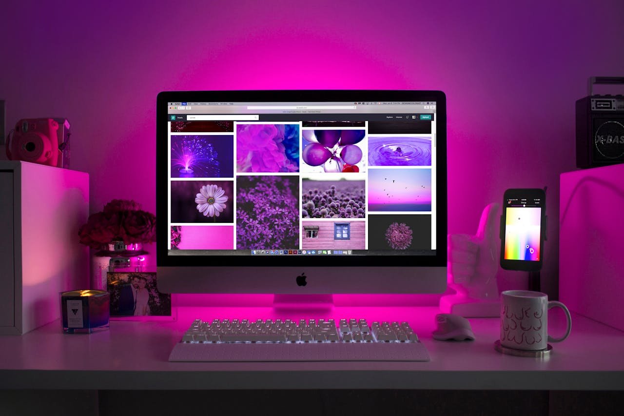 our-mission Modern desk setup with neon lighting and a desktop computer displaying colorful images.